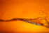 A blurry image of an orange background